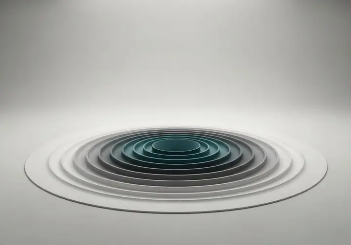 Concentric grey and teal rings radiating outward on a plain background